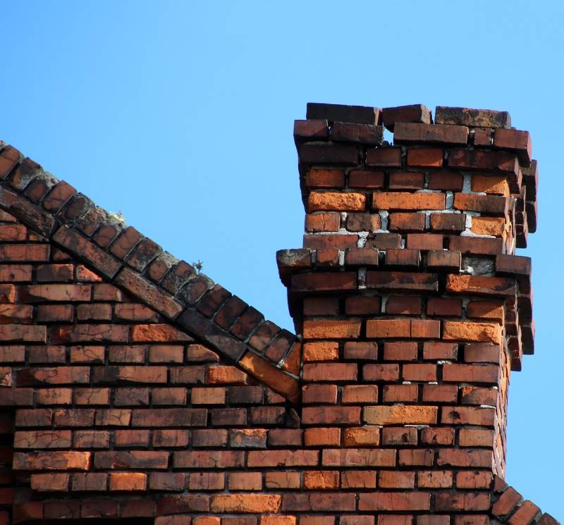 Signs Your Placentia Home Needs a Chimney Inspection Damaged chimney on an Placentia home showing cracks and missing mortar